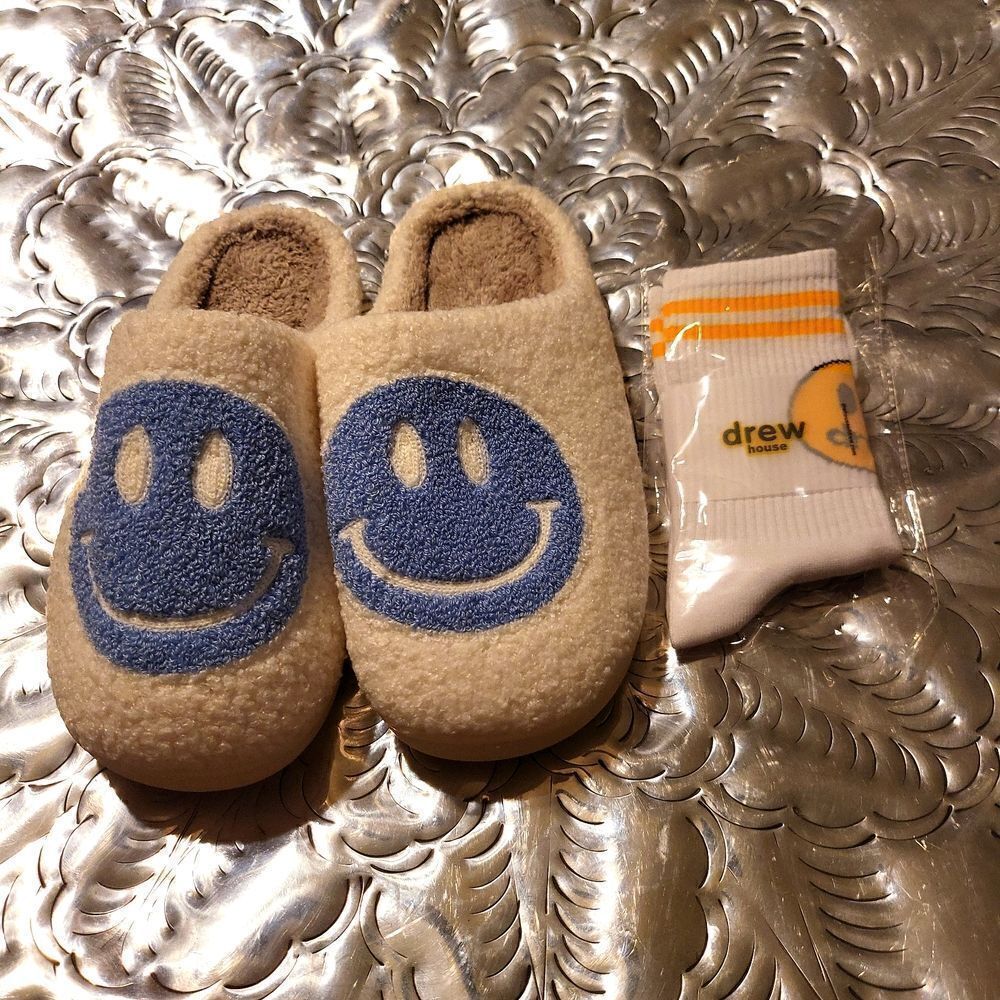 A set of house shoes,brand new,and a pair of socks! So plush!;smiley/ drew house